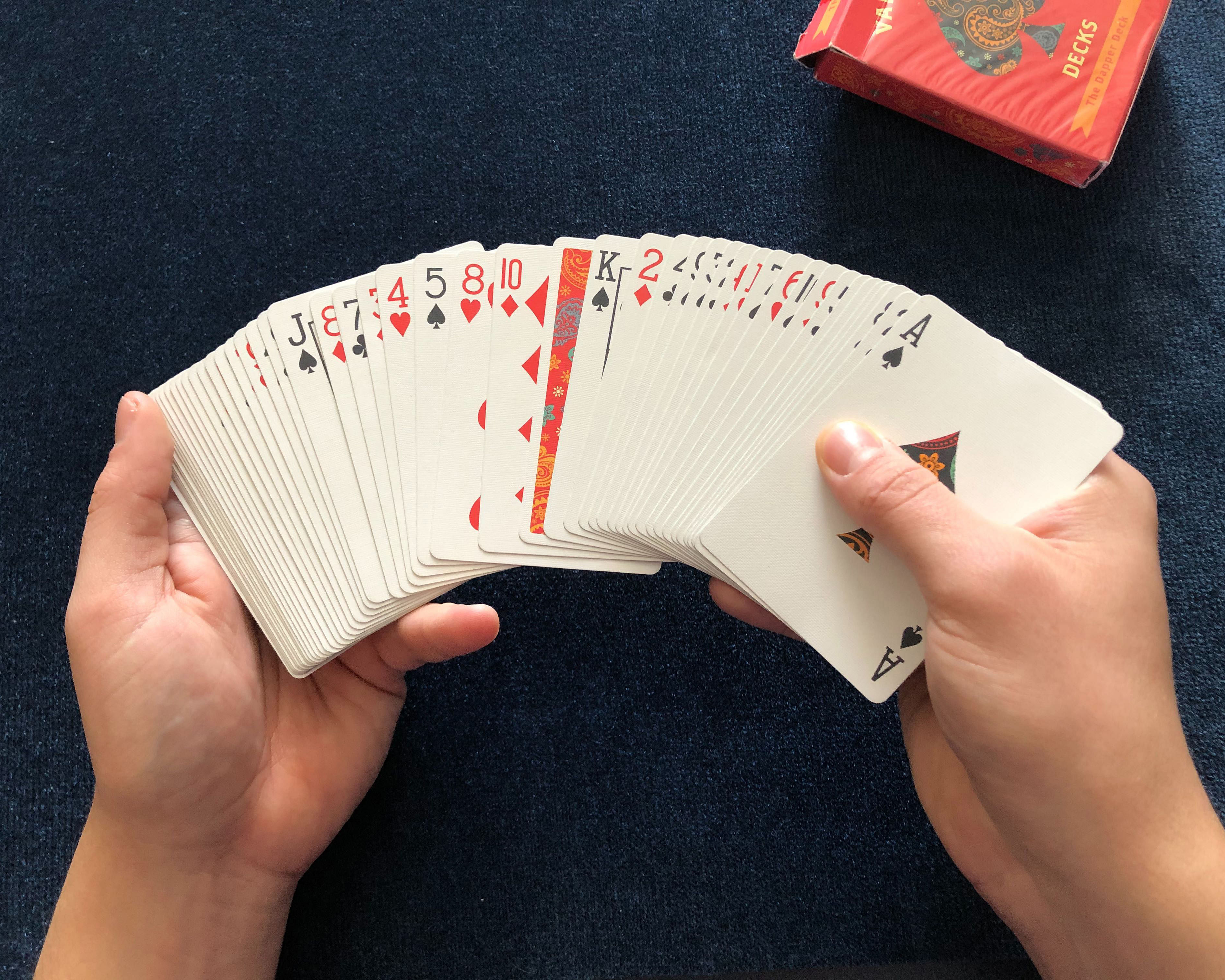 An easy card trick where one playing card turns over in a deck of cards is performed with The Dapper Deck Playing Cards from Vanishing Inc.