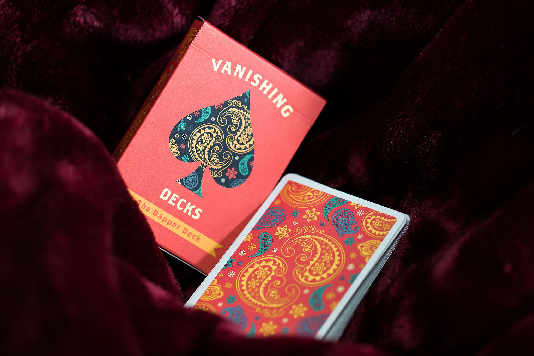 An orange deck of gorgeous Vanishing Inc. Dapper Deck Playing Cards