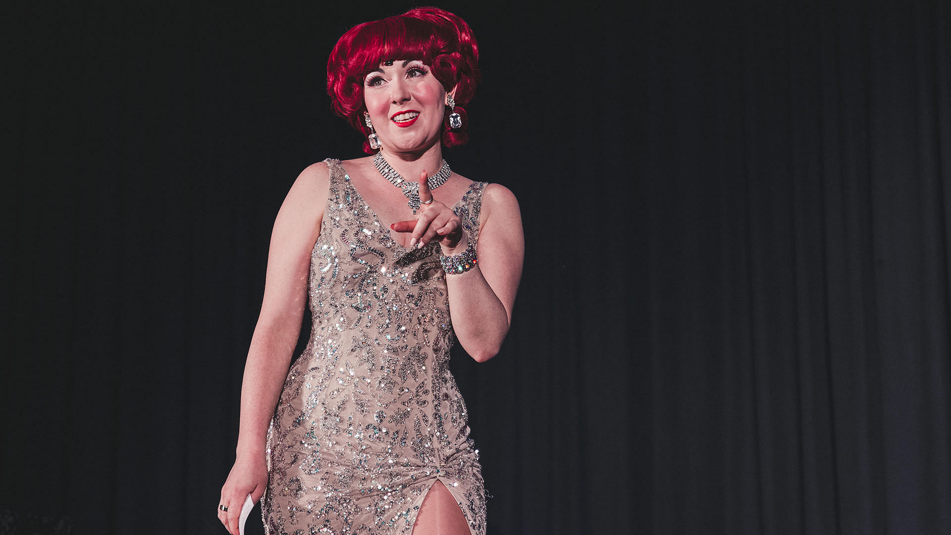 magician Carisa Hendrix on stage as Lucy Darling