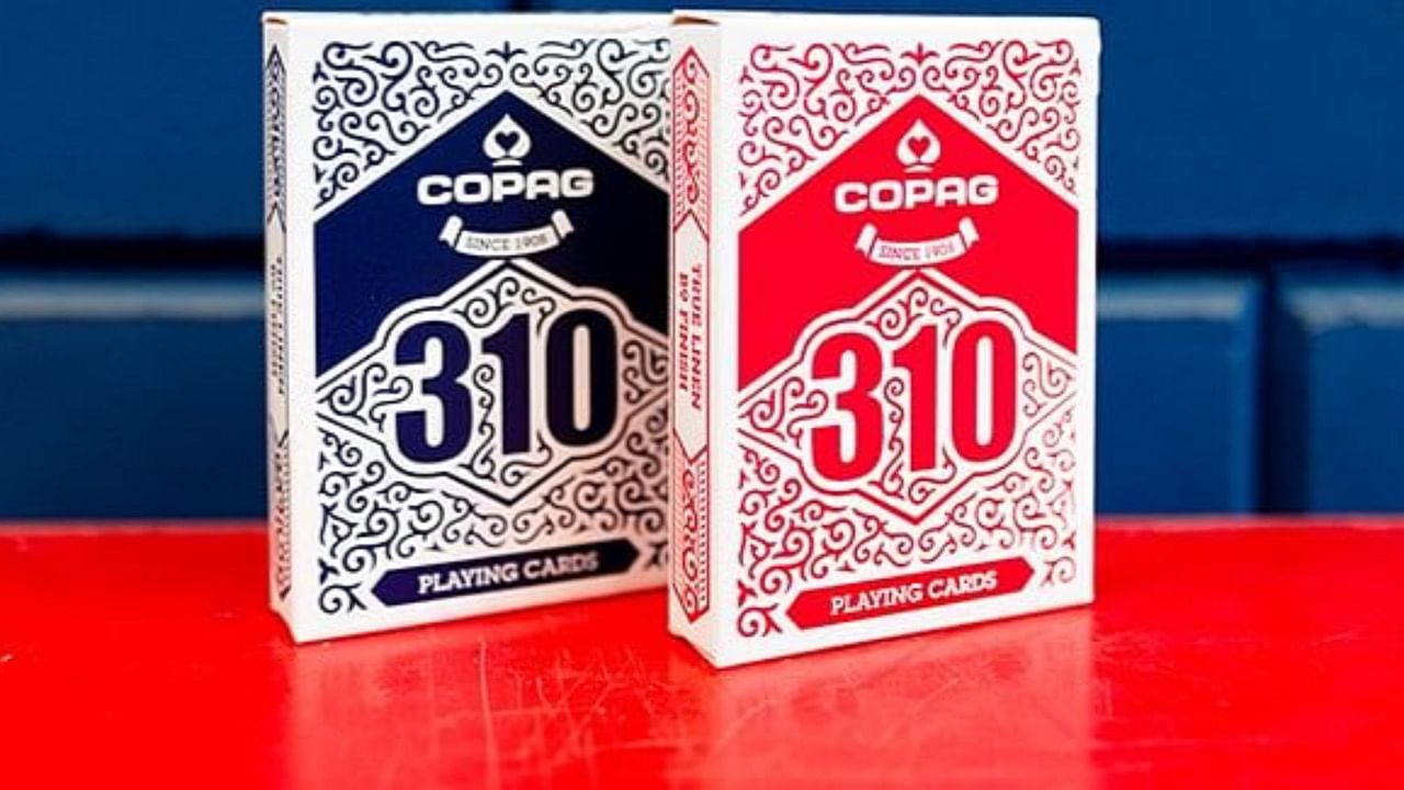 red and blue copag 310 playing cards by cartamundi