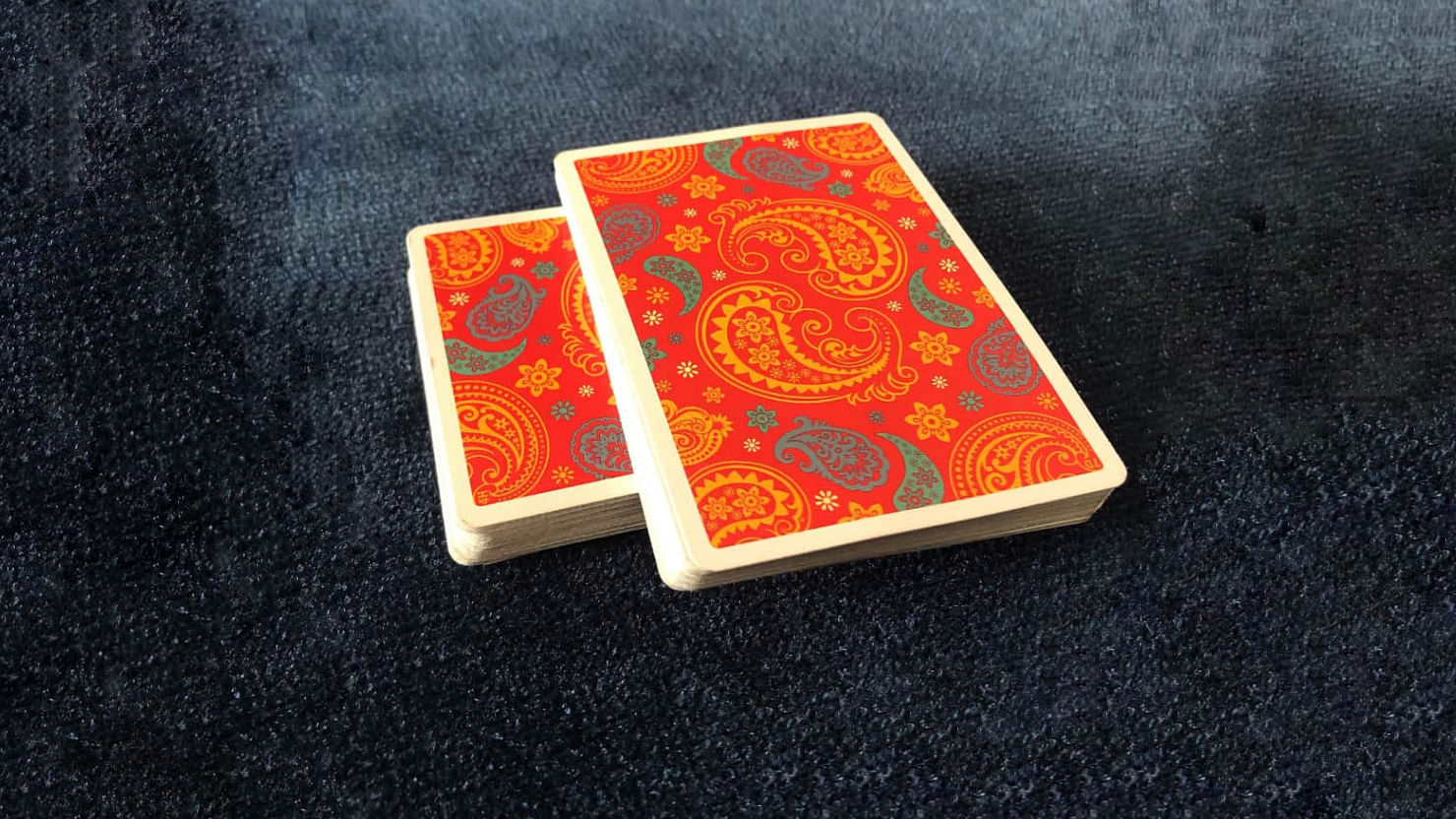 The Dapper Deck Playing Cards from Vanishing Inc. are used to before an easy card trick with the cross cut force