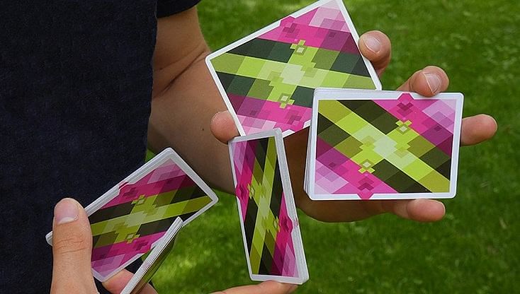 Cool cardistry fan with diamon playing cards is used to enhance an card magic trick