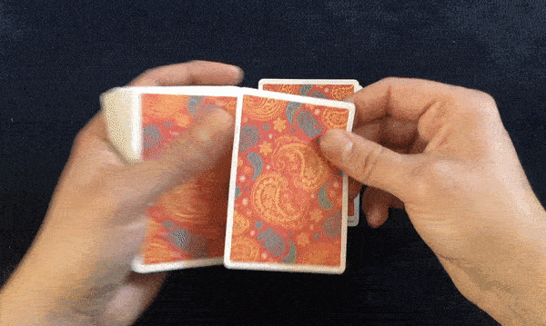 dealing playing cards onto table
