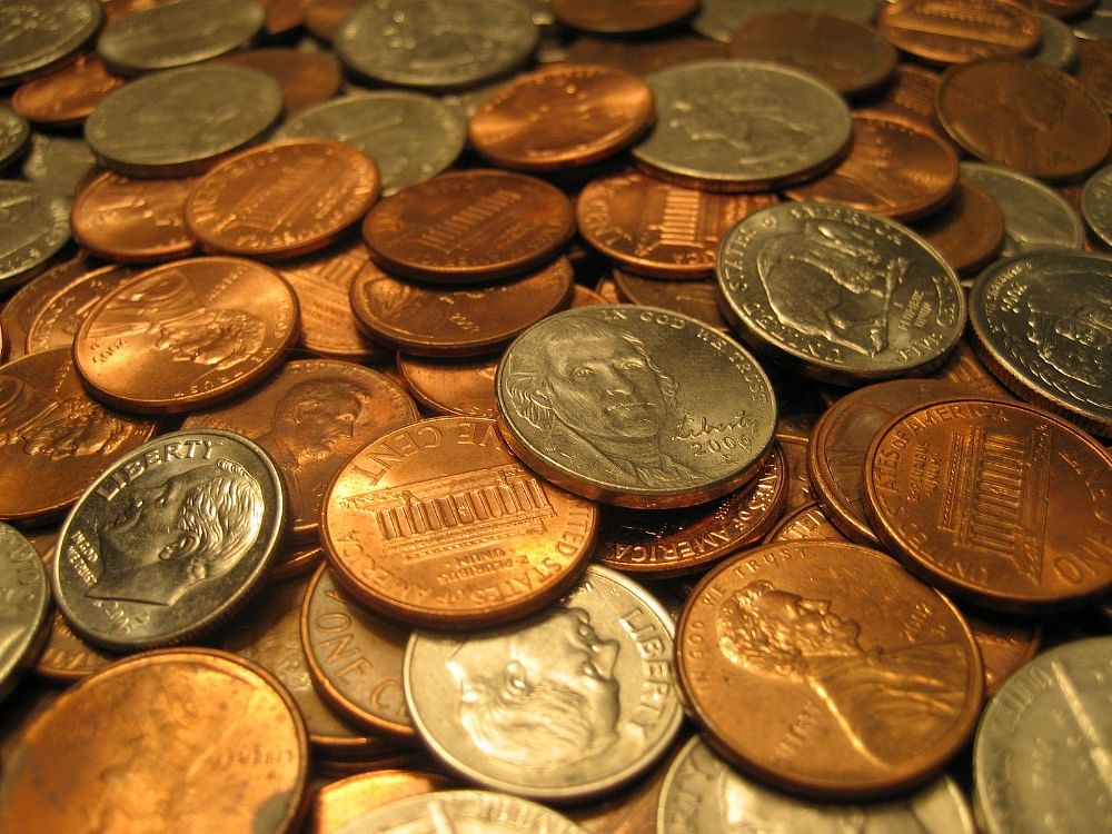 A pile of American coins used for a mind reading beginner magic trick