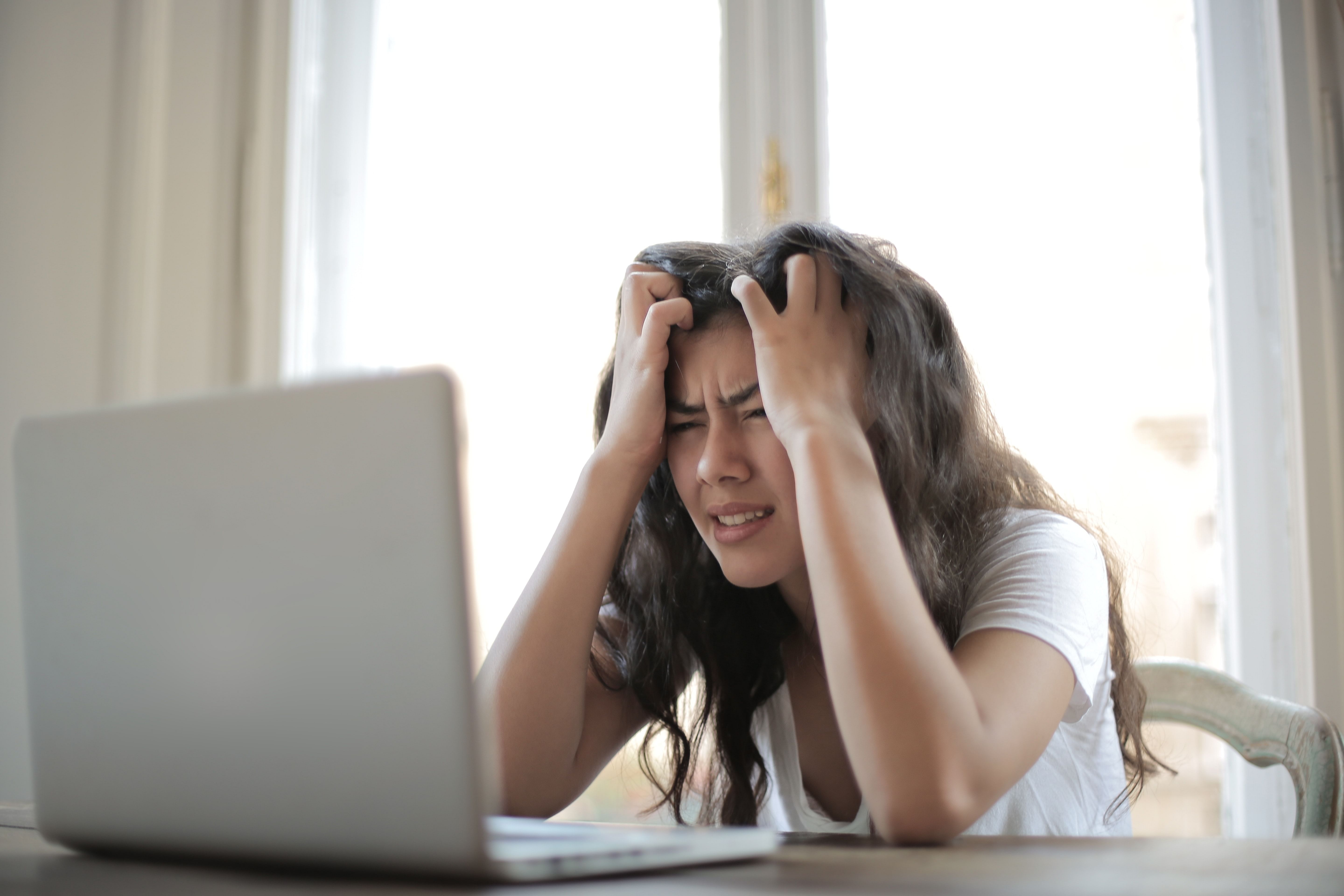 woman frustrated by a inbox full of spam mail