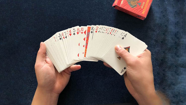 An easy card trick where one playing card turns over in a deck of cards is performed with The Dapper Deck Playing Cards from Vanishing Inc.