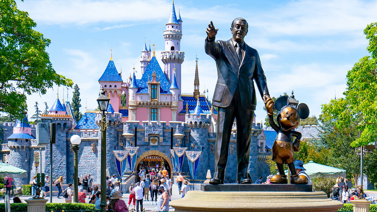 Walt Disney and Mickey Statue in Disneyland outside Sleeping Beauty Castle on beautiful day