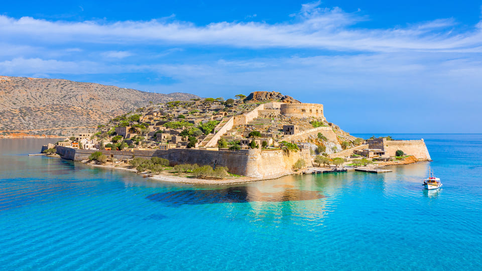 View of historic Spinalonga Island fortress with turquoise waters