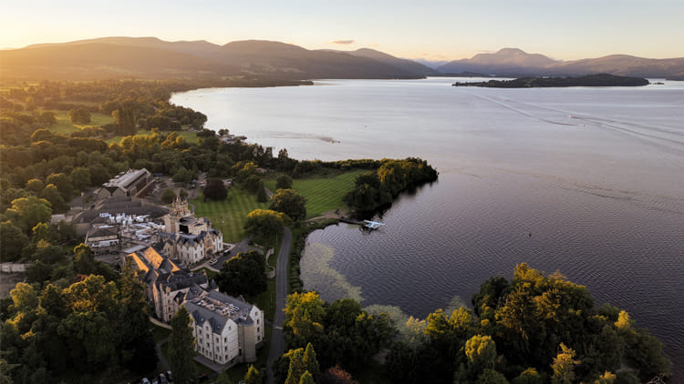 Cameron House and Loch Lomond seen from above at sunset